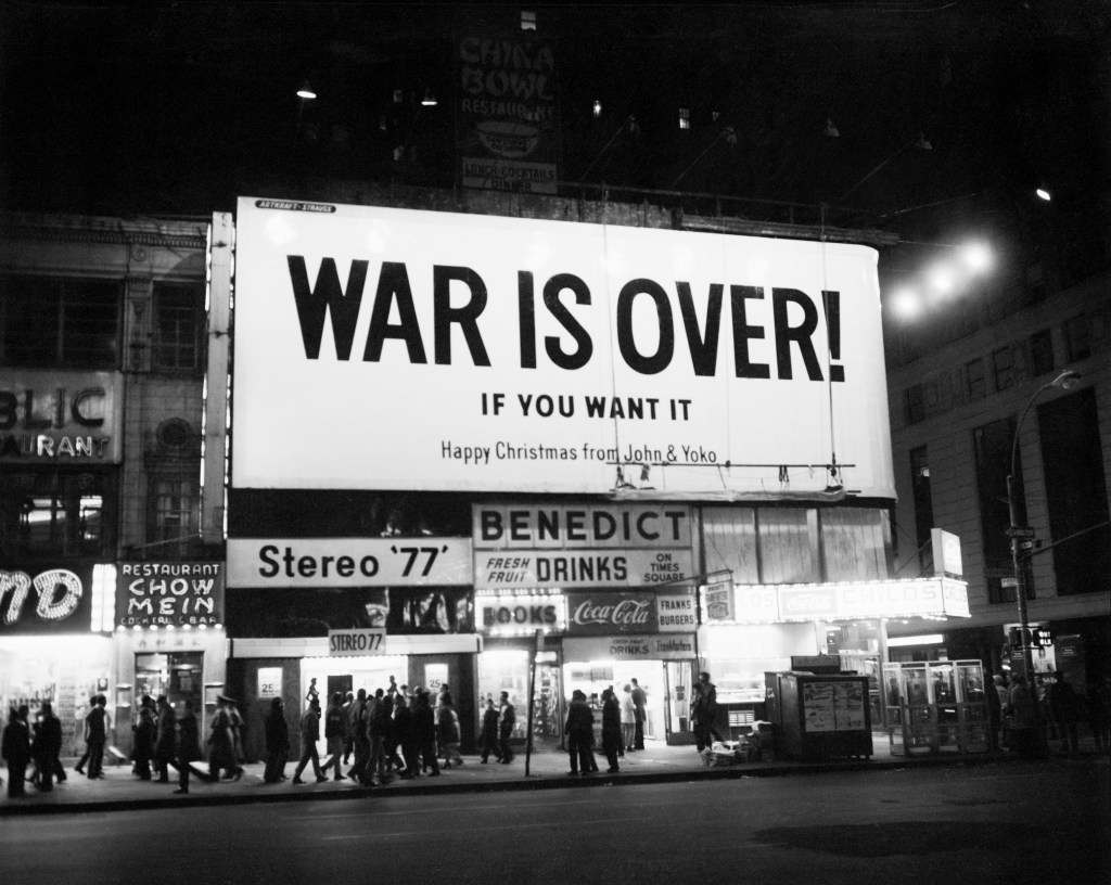 Sign on Times Square reads "War is Over... If you want it. Happy Christmas from John and Yoko."