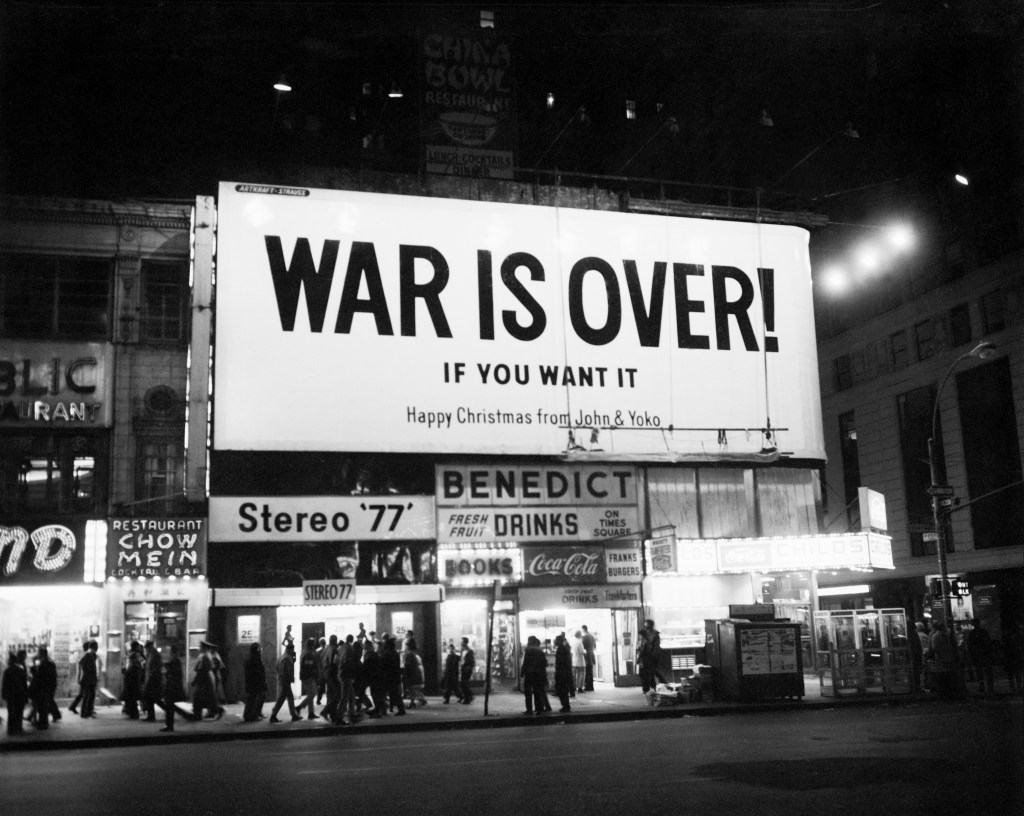 Sign on Times Square reads "War is Over... If you want it. Happy Christmas from John and Yoko." 