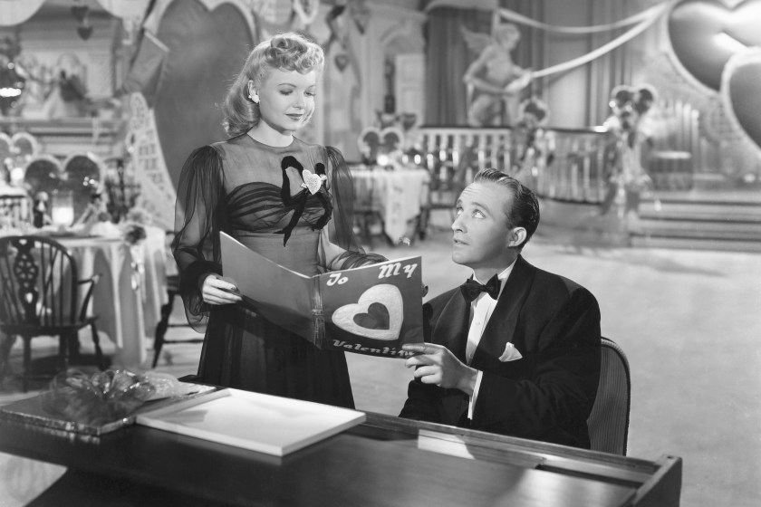 Linda Mason (Marjorie Reynolds) joins Jim Hardy (Bing Crosby) at the piano to look at a Valentine in his nightclub the Holiday Inn in the 1942 musical Holiday Inn.