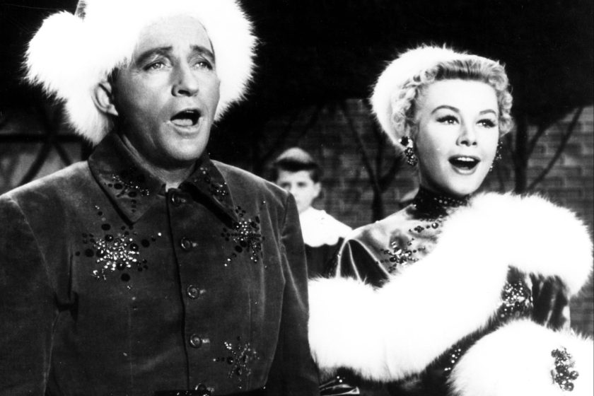 American singer and actor Bing Crosby (1903 - 1977) and American actress and dancer Vera-Ellen (1921 - 1981) in 'White Christmas', directed by Michael Curtiz, 1954. 