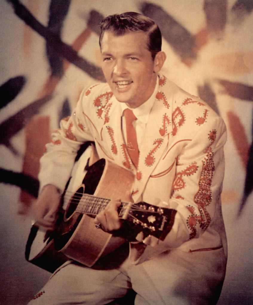 Bobby Helms holding a guitar.