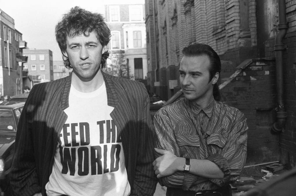 Bob Geldof and Midge Ure pictured outside SARM Studios in Notting Hill, London, during the recording of the Band Aid single 'Do They Know It's Christmas?'