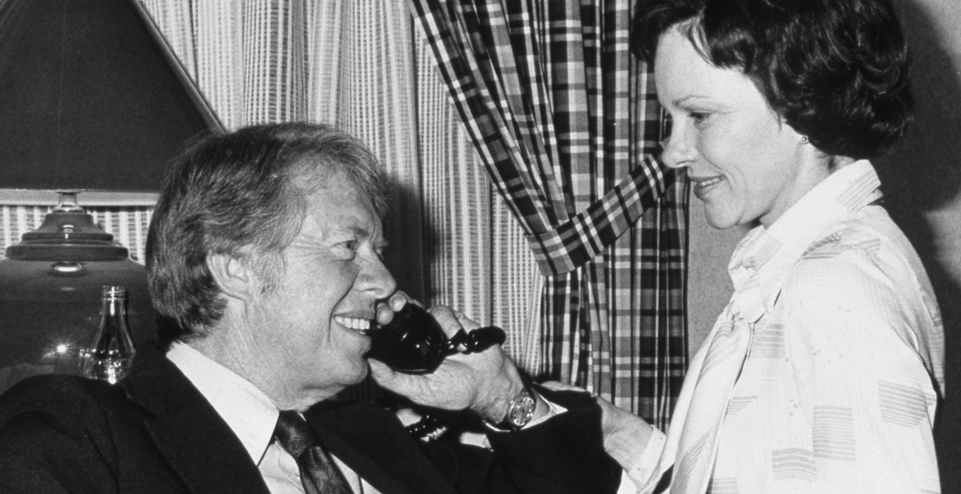 American politician and US Presidential candidate Jimmy Carter and his wife, Rosalynn Carter, talk on the telephone after his victory in the Pennsylvania Primary election, Philadelphia, Pennsylvania, April 27, 1976. (Photo by Mikki Ansin/Getty Images)