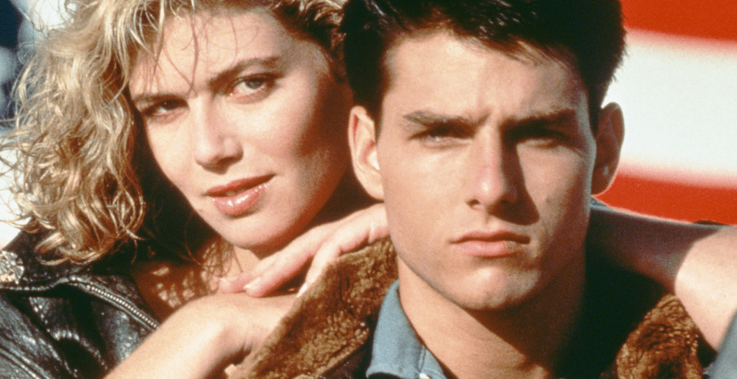 American actors Tom Cruise, as Lieutenant Pete 'Maverick' Mitchell, and Kelly McGillis, as Charlotte 'Charlie' Blackwood, in a promotional portrait for 'Top Gun', directed by Tony Scott, 1986.