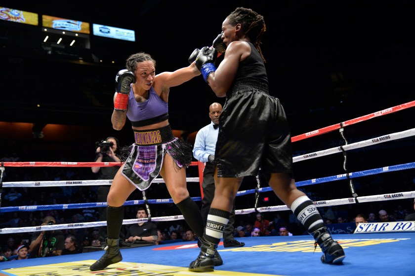 UNCASVILLE, CT - NOVEMBER 25: Kali Reis (red tape) takes on Tiffany Woodard (blue tape) in a Middleweight bout on November 25, 2017 at the Mohegan Sun Arena in Uncasville, Connecticut. Kali Reis defeats Tiffany Woodard via decision.
