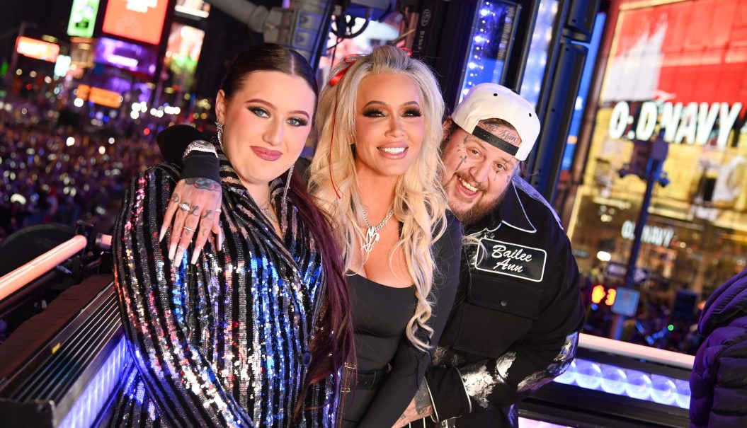Guest, Bunnie Xo, and Jelly Roll pose onstage during Dick Clark's New Year's Rockin' Eve with Ryan Seacrest 2024 in Times Square on December 31, 2023 in New York, New York.