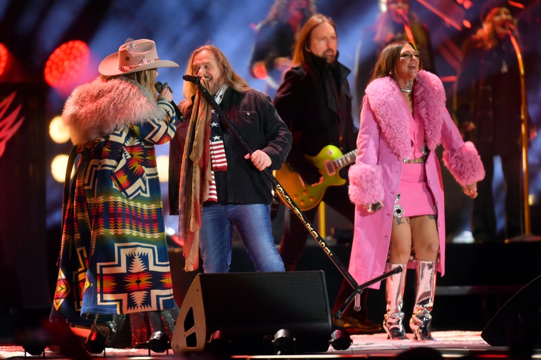 NASHVILLE, TENNESSEE - DECEMBER 31: (L-R) Lainey Wilson, Johnny Van Zant of Lynyrd Skynyrd and Elle King perform onstage for New Year's Eve Live: Nashville's Big Bash at Bicentennial Capitol Mall State Park on December 31, 2023 in Nashville, Tennessee.