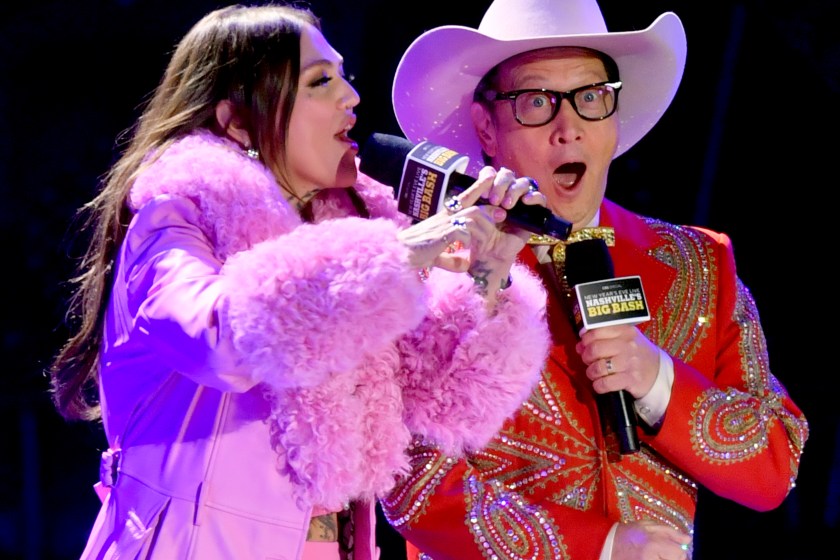 NASHVILLE, TENNESSEE - DECEMBER 31: (L-R) Elle King and Rob Schneider speak onstage for New Year's Eve Live: Nashville's Big Bash at Bicentennial Capitol Mall State Park on December 31, 2023 in Nashville, Tennessee.