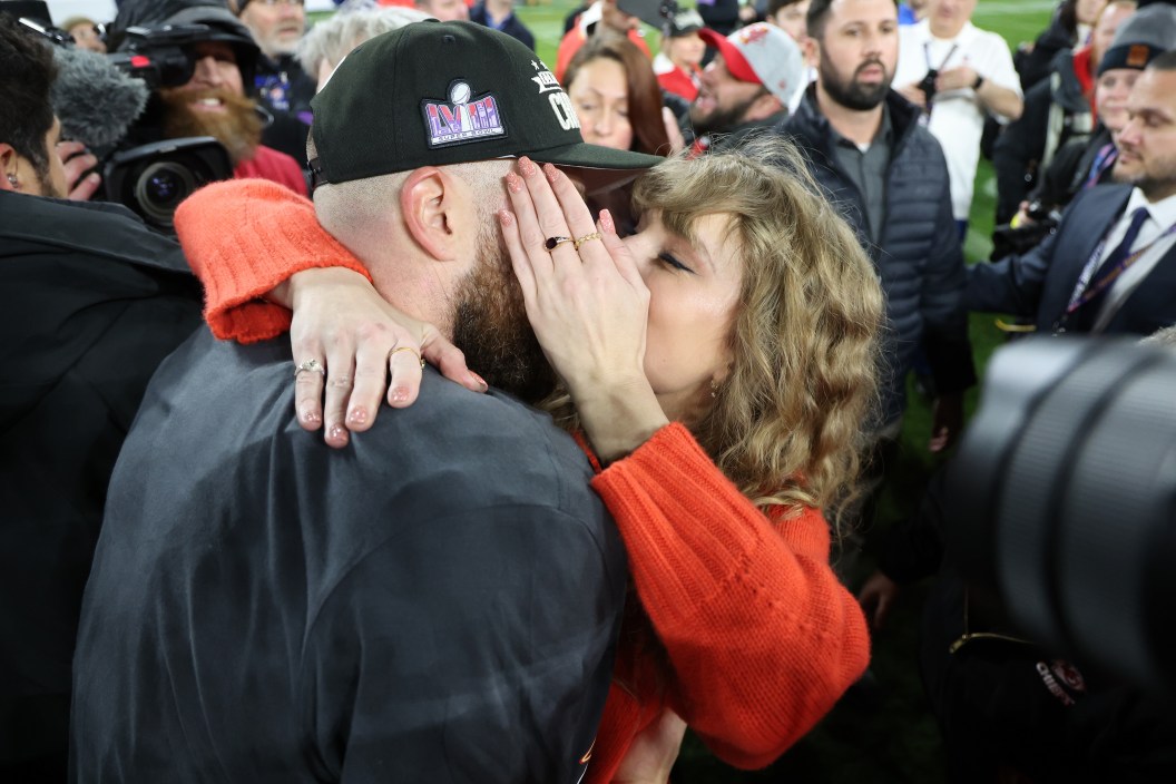 BALTIMORE, MARYLAND - JANUARY 28: Travis Kelce #87 of the Kansas City Chiefs celebrates with Taylor Swift after a 17-10 victory against the Baltimore Ravens in the AFC Championship Game at M&T Bank Stadium on January 28, 2024 in Baltimore, Maryland.