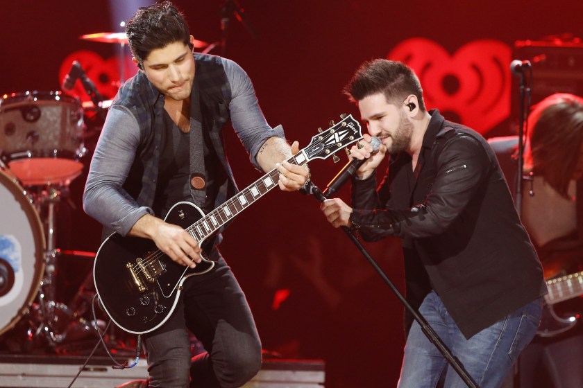 AUSTIN, TX - MARCH 29: Dan Smyers (L) and Shay Mooney of Dan + Shay perform onstage during the iHeartRadio Country Festival at the Frank Erwin Center on March 29, 2014 in Austin, Texas.