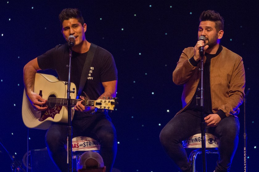 CHICAGO, ILLINOIS - NOVEMBER 09: Dan Smyers and Shay Mooney of Dan + Shay perform at CBS RADIOs second annual Stars and Strings concert at The Chicago Theatre on November 9, 2016 in Chicago, Illinois.