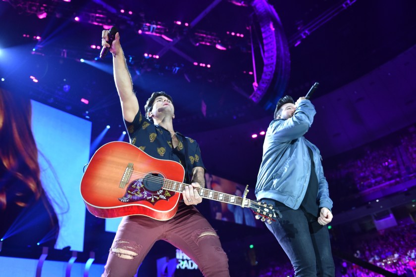 AUSTIN, TX - MAY 05: (EDITORIAL USE ONLY. NO COMMERCIAL USE) Dan Smyers (L) and Shay Mooney of musical group Dan + Shay perform onstage during the 2018 iHeartCountry Festival By AT&T at The Frank Erwin Center on May 5, 2018 in Austin, Texas. 