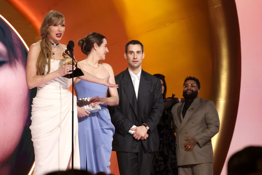 LOS ANGELES, CALIFORNIA - FEBRUARY 04: (L-R) Taylor Swift accepts the Album Of The Year award for "Midnights" with Laura Sisk and Jack Antonoff onstage during the 66th GRAMMY Awards at Crypto.com Arena on February 04, 2024 in Los Angeles, California. 