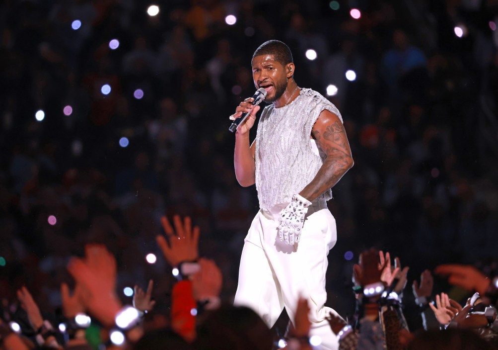 LAS VEGAS, NEVADA - FEBRUARY 11: Usher performs onstage during the Apple Music Super Bowl LVIII Halftime Show at Allegiant Stadium on February 11, 2024 in Las Vegas, Nevada. Jackson State University’s Sonic Boom of the South Marching Band make a special appearance with eight-time Grammy-winning artist Usher during the show.