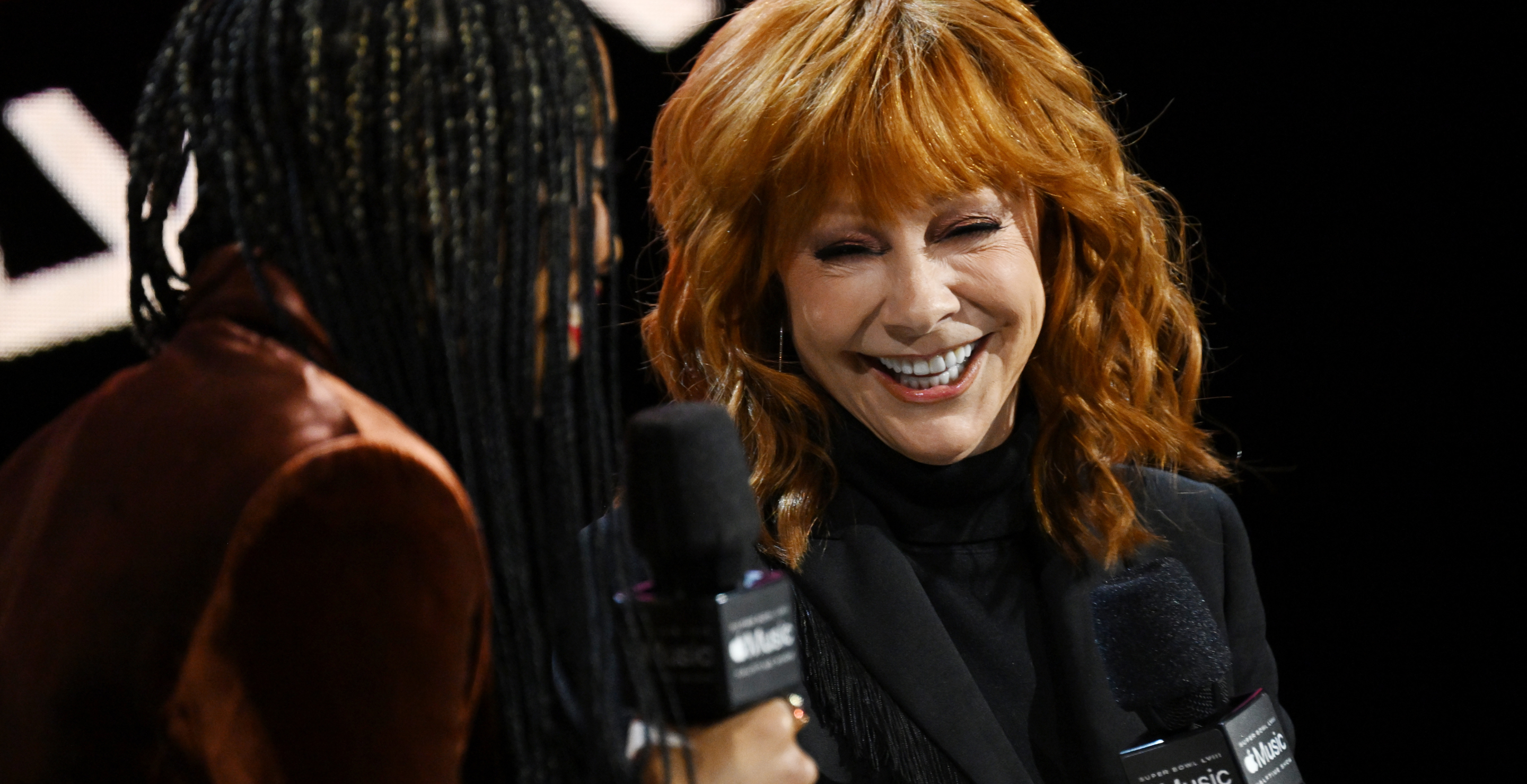 Reba McEntire is interviewed by Nadeska Alexis during the Super Bowl LVIII Pregame & Apple Music Super Bowl LVIII Halftime Show press conference at the Mandalay Bay Convention Center on February 08, 2024 in Las Vegas, Nevada.