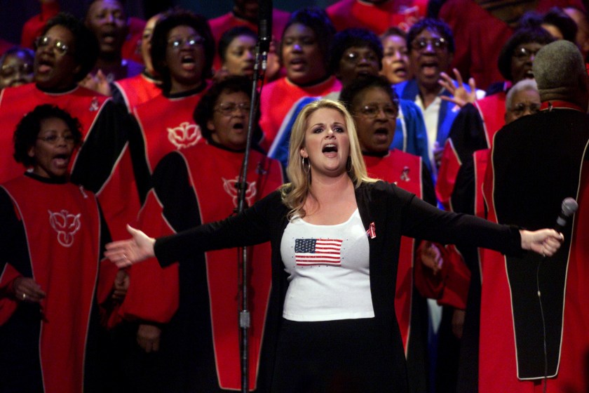396207 24: Trisha Yearwood performs "We Shall Be Free" with a choir at the Country Freedom Concert October 21, 2001 at Nashville's Gaylord Entertainment Center. The concert will benefit the Salvation Army's Disaster Relief Fund and the victims, families and rescue workers affected by the events of September 11th.