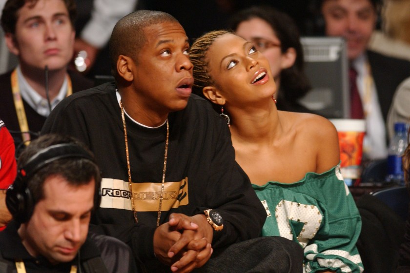 ATLANTA, GA - FEBRUARY 9: Rapper Jay-Z and singer Beyonce Knowles watch the action during the 2003 NBA All-Star game at the Phillips Arena February 9, 2003 in Atlanta, Georgia. 