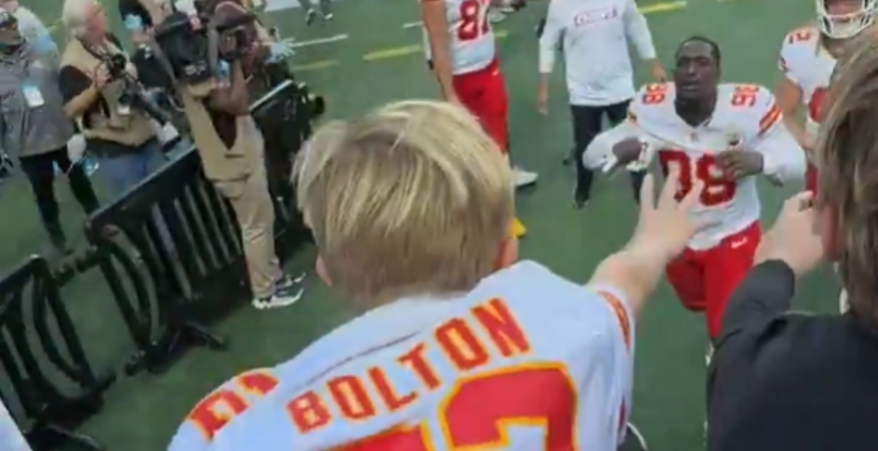 kid saved by kansas chiefs player when falls over bleachers
