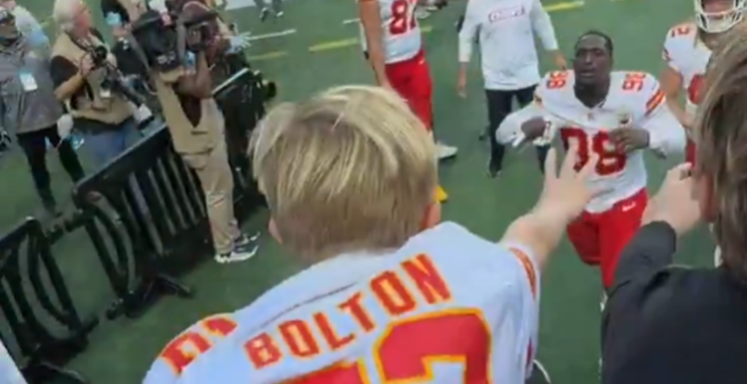 kid saved by kansas chiefs player when falls over bleachers