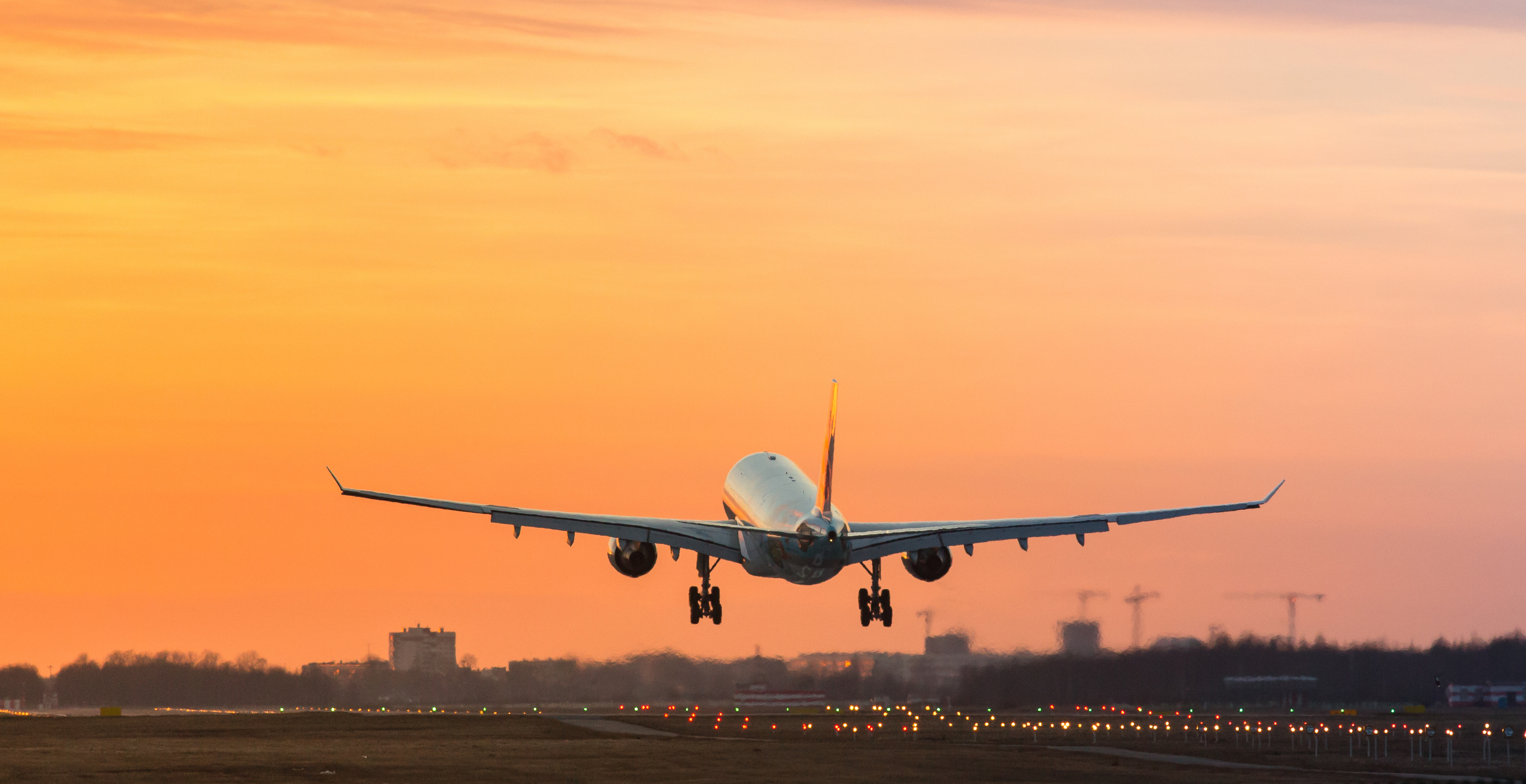 anxious flier opens emergency door and climbs onto plane wing