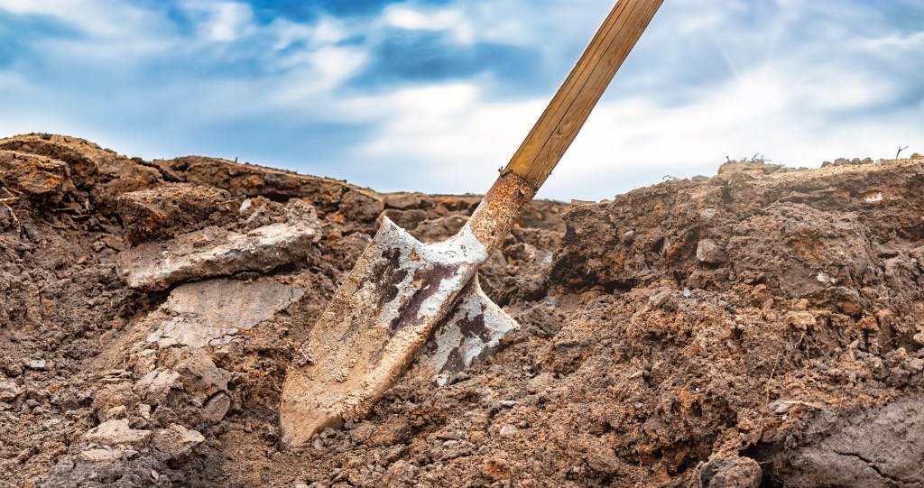 woman finds neighbor digging trench in her backyard
