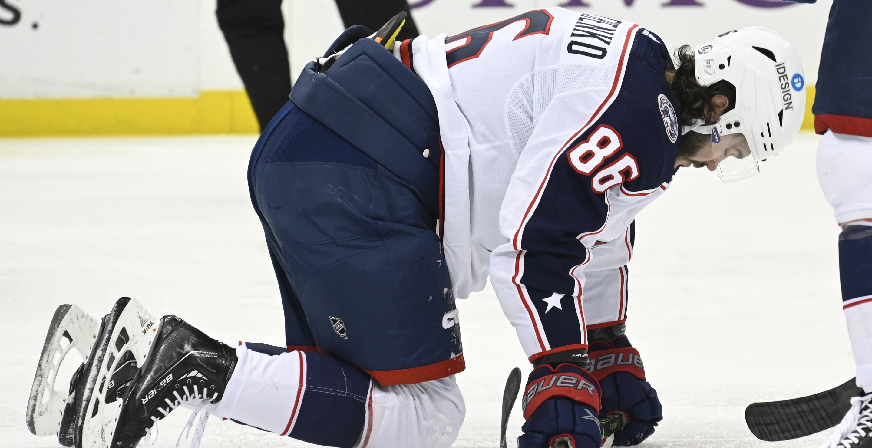 NHL Player Takes Puck To The Face While Sitting In Bench In Gnarly Injury