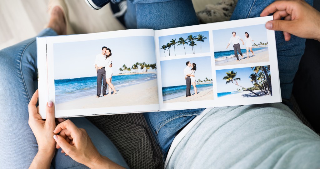 couple looking at vacation photo album