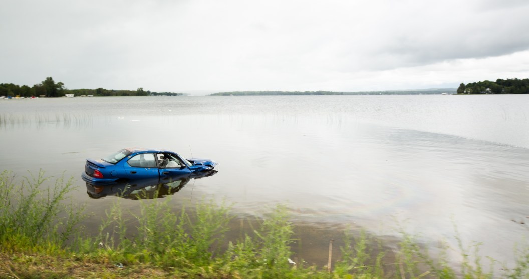 husband fails to save wife after car crashes into pond