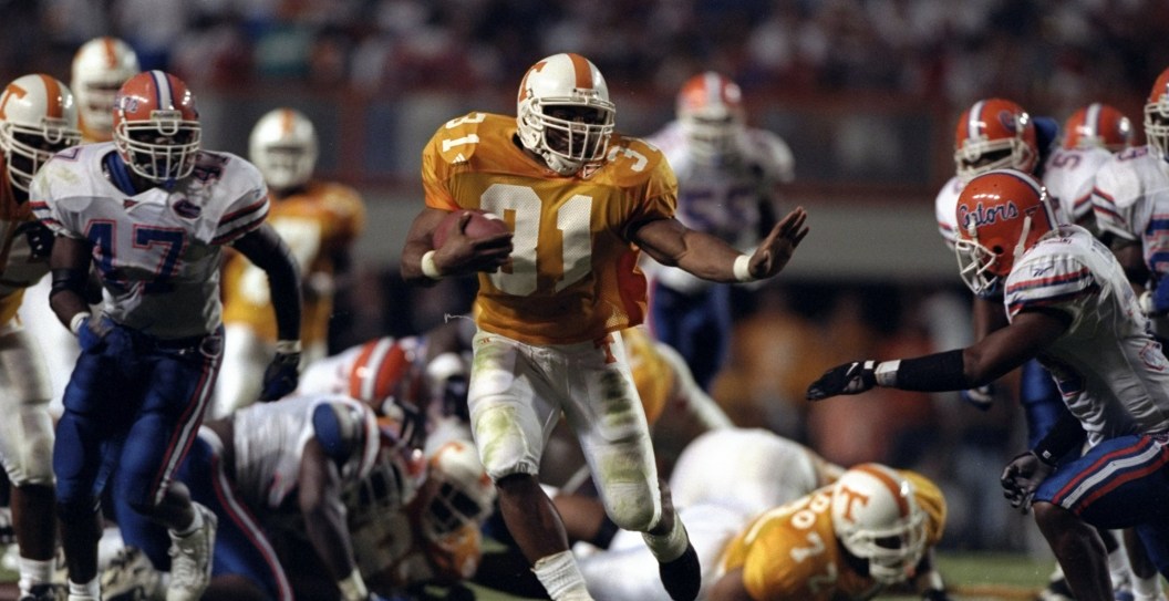 19 Sep 1998: Running back Jamal Lewis #31 of the Tennessee Volunteers in action against free safety Teako Brown #33 of the Florida Gators during a game at the Neyland Stadium in Knoxville, Tennessee. The Volunteers defeated the Gators 20-17. Mandatory Cr