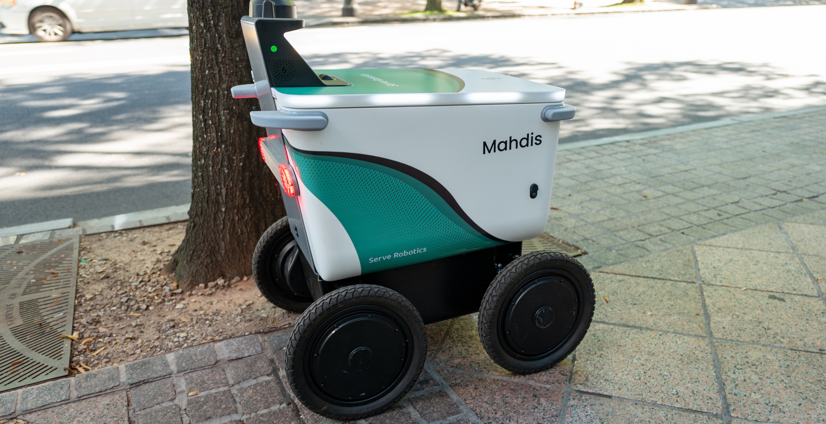 Delivery Robot Crashes Through Bus Stop Glass