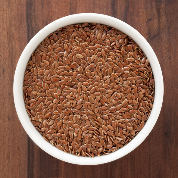 Top view of white bowl full of flax seeds