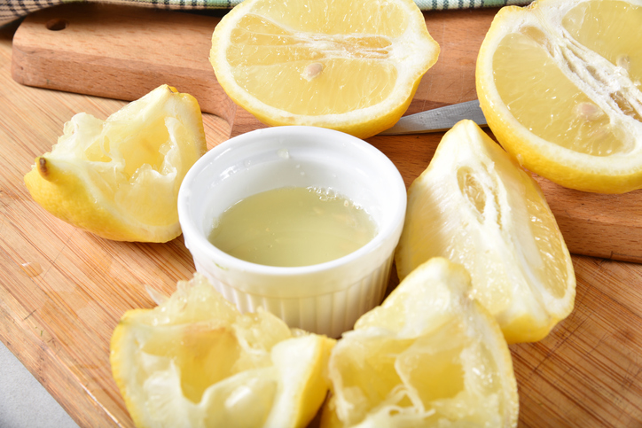 Fresh squeezed lemon juice on a cutting board