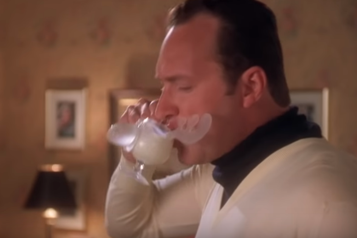 A glass of rich Christmas Vacation eggnog ready for a holiday gathering