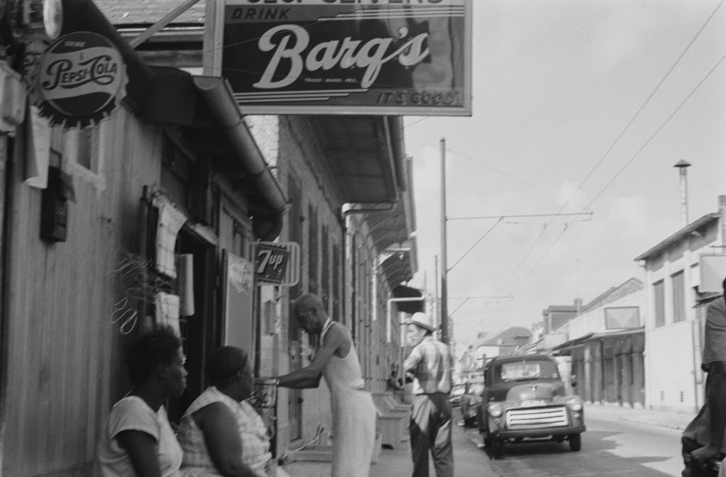 Advertisements for Barq's root beer, Pepsi-Cola and 7Up in the French Quarter or Vieux Carré of New Orleans, Louisiana,  July 1961. 