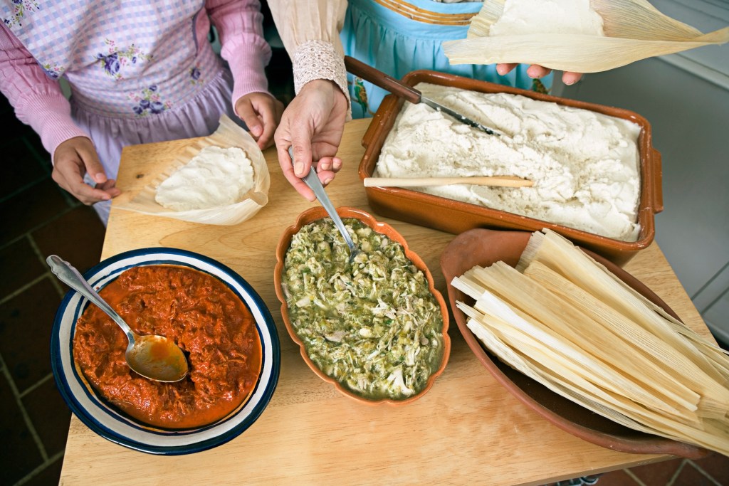 woman making tamales