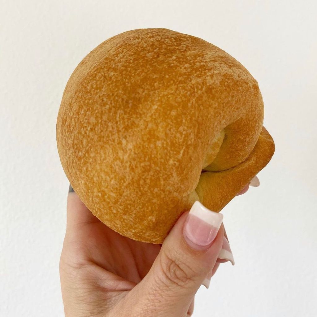 woman holding a pastry