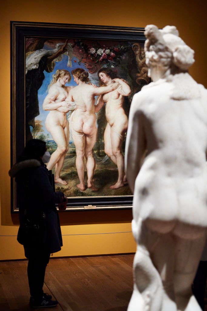  A woman observes Rubens painting 'The Three Graces' belonging to the exhibition 'Mythological Passions' (Pasiones Mitologicas) at the Prado Museum