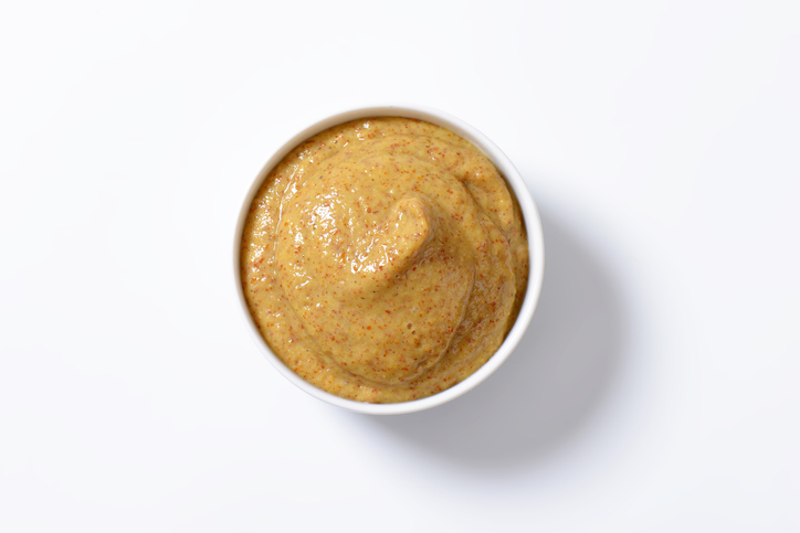 bowl of mustard isolated on white  background