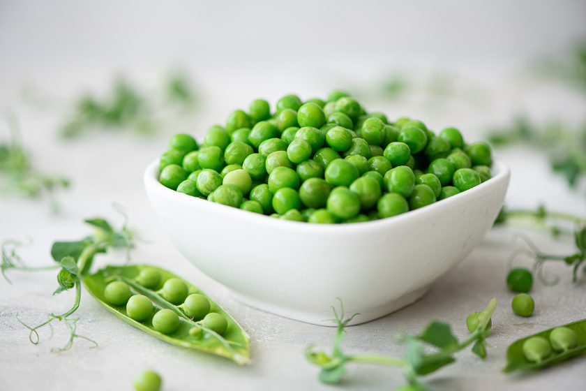 multiple types of peas in bowl and table