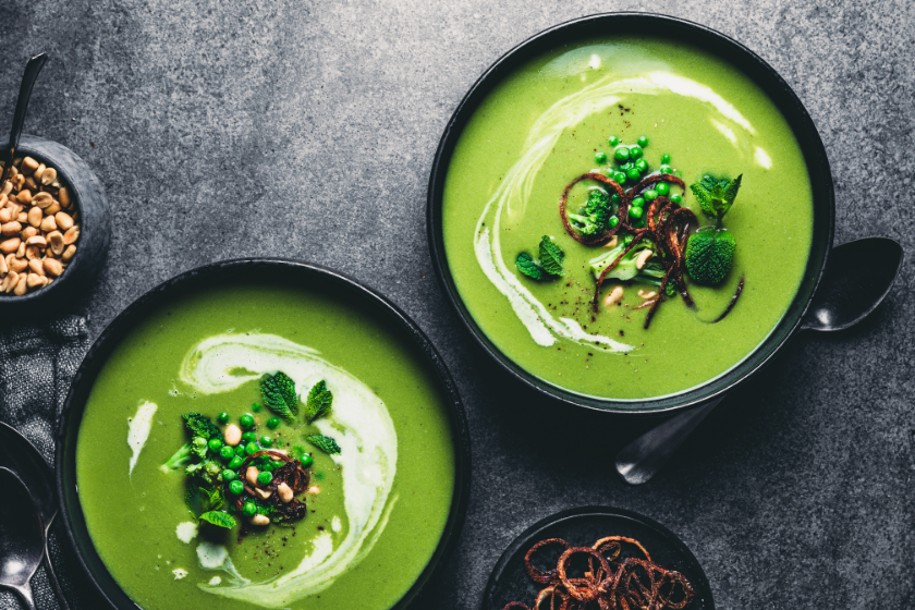 bowls of pea soup on table