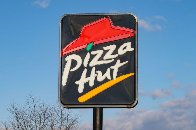 A view of a Pizza Hut restaurant sign and logo