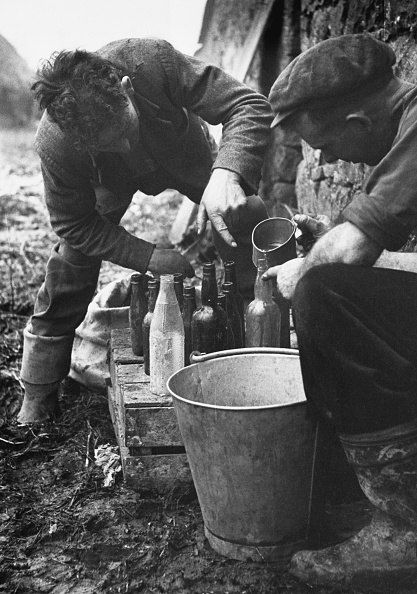 Poteen or poitin makers are still active in remote parts of Ireland despite official dissaproval. A local 'specialist' in the illegal liquor shows how it is made. The poteen makers store the liquid into old lemonade or medicine bottles.