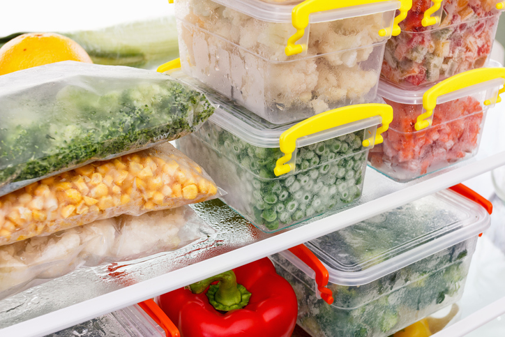 Frozen food in the refrigerator. Vegetables on the freezer shelves. Stocks of meal for the winter.
