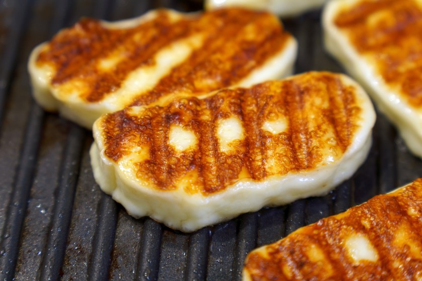 Cyprus fried halloumi cheese. Balanced food, close up. Cooking on a grill pan